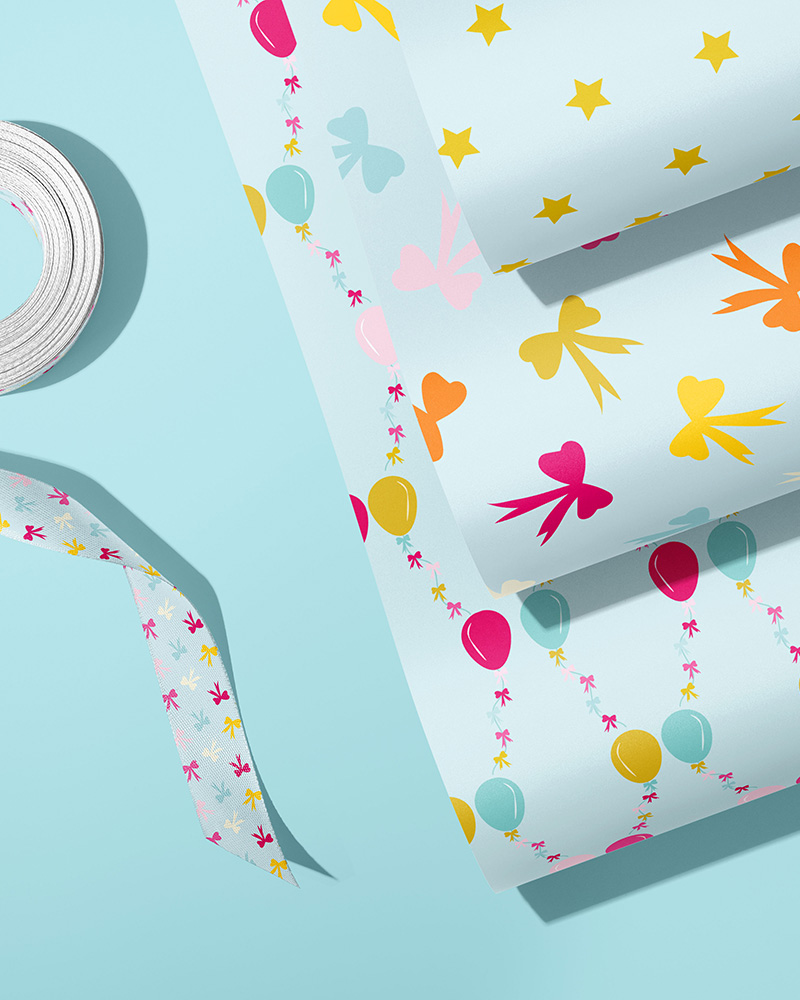 An image of three different designs of gift wrap and coordinating ribbon. Party.