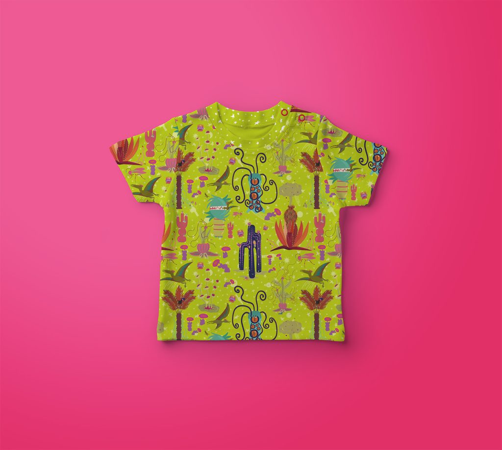 Image of a baby t-shirt featuring the  "Creatures" pattern in green.