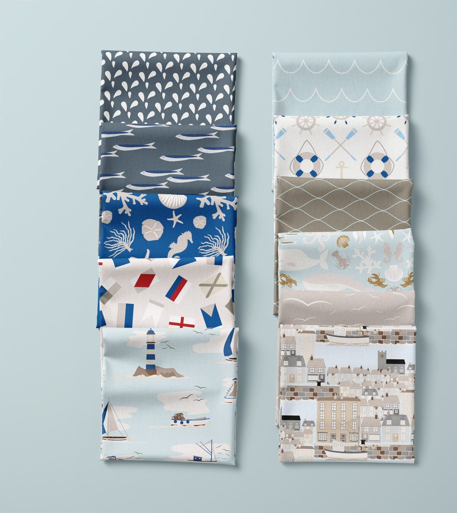Image of 11 folded fabric squares featuring patterns from Seaweed & Spruce's Quayside pattern collection.