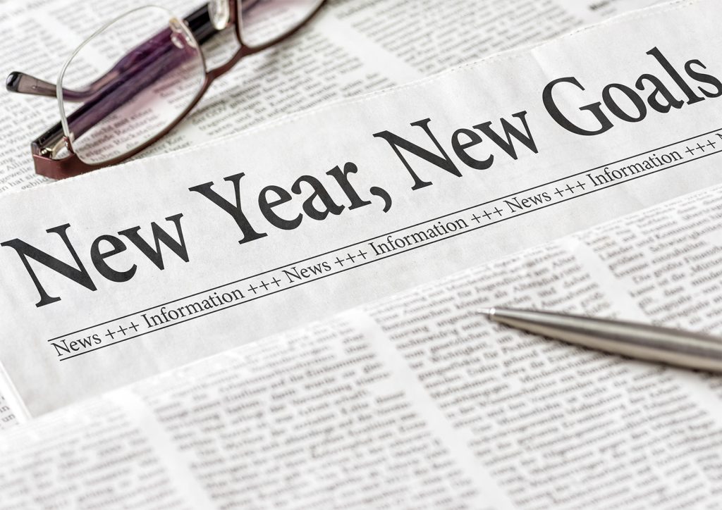 Image of a newspaper headline with the words "New Year, New Goals".