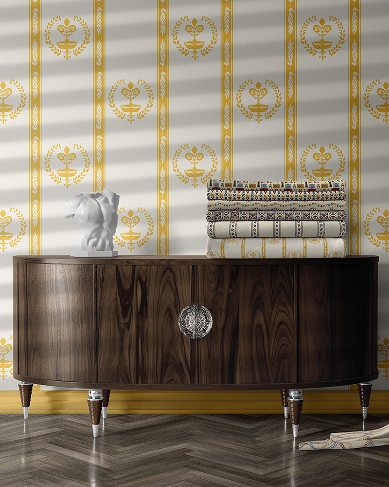 An image of a room with wallpaper and textiles featuring patterns from the Primitive Collection.