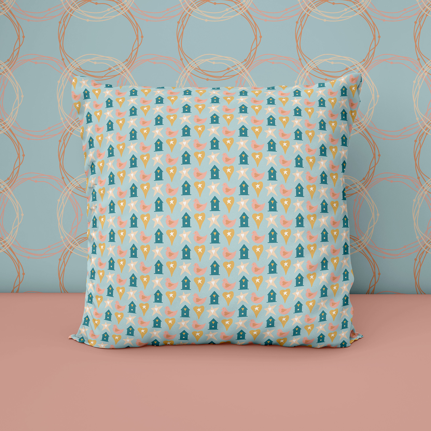 An image of a cushion featuring "Icons" in Savannah Sunset colour palette. The backdrop wall features "Wire Wreaths" design in the same colour palette.