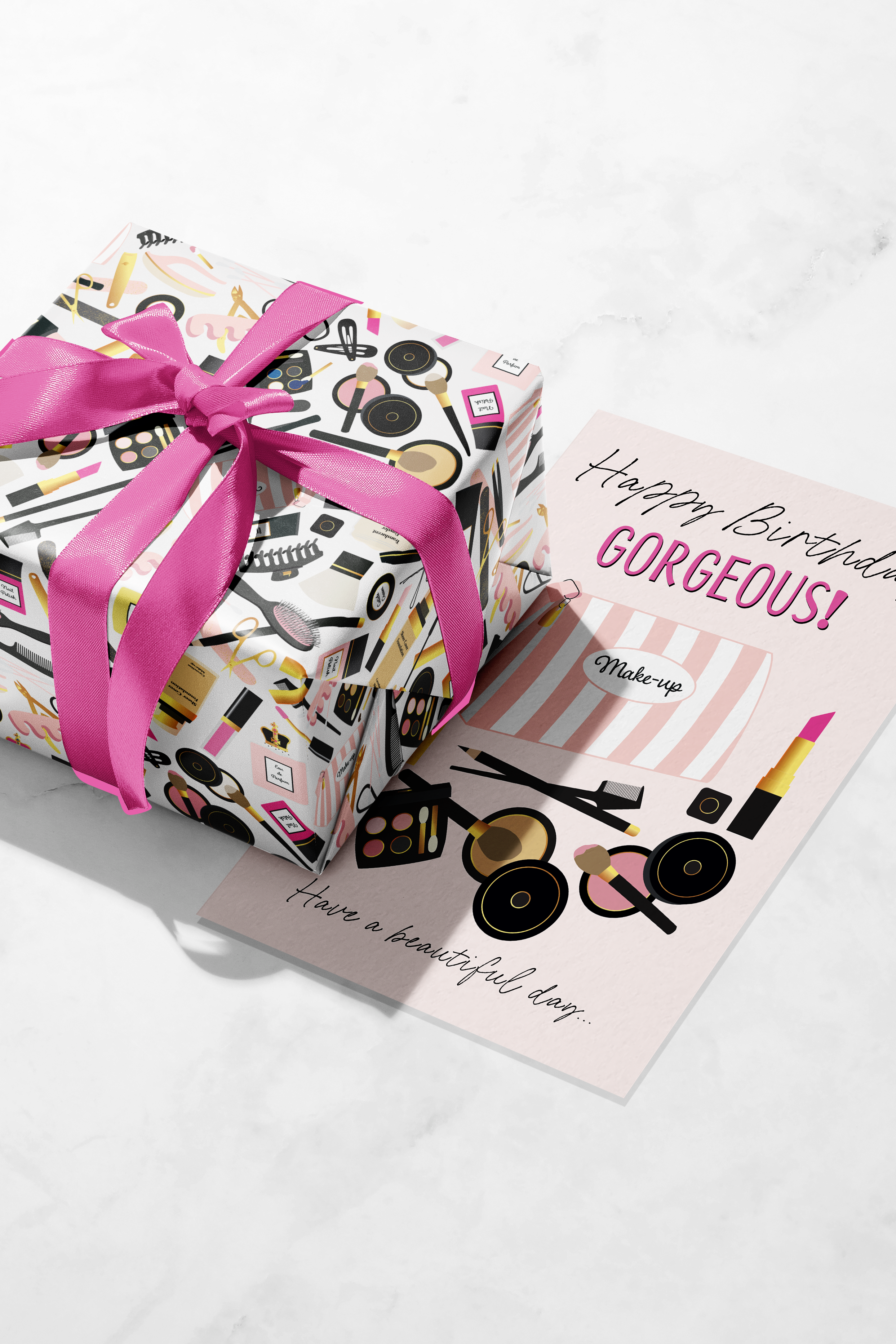 An image showing a birthday card and wrapped gift, both featuring illustrations from the Adorable Me collection of beauty-inspired illustrations. The colours used are pink, cerise, black and off-white. Print on Demand.