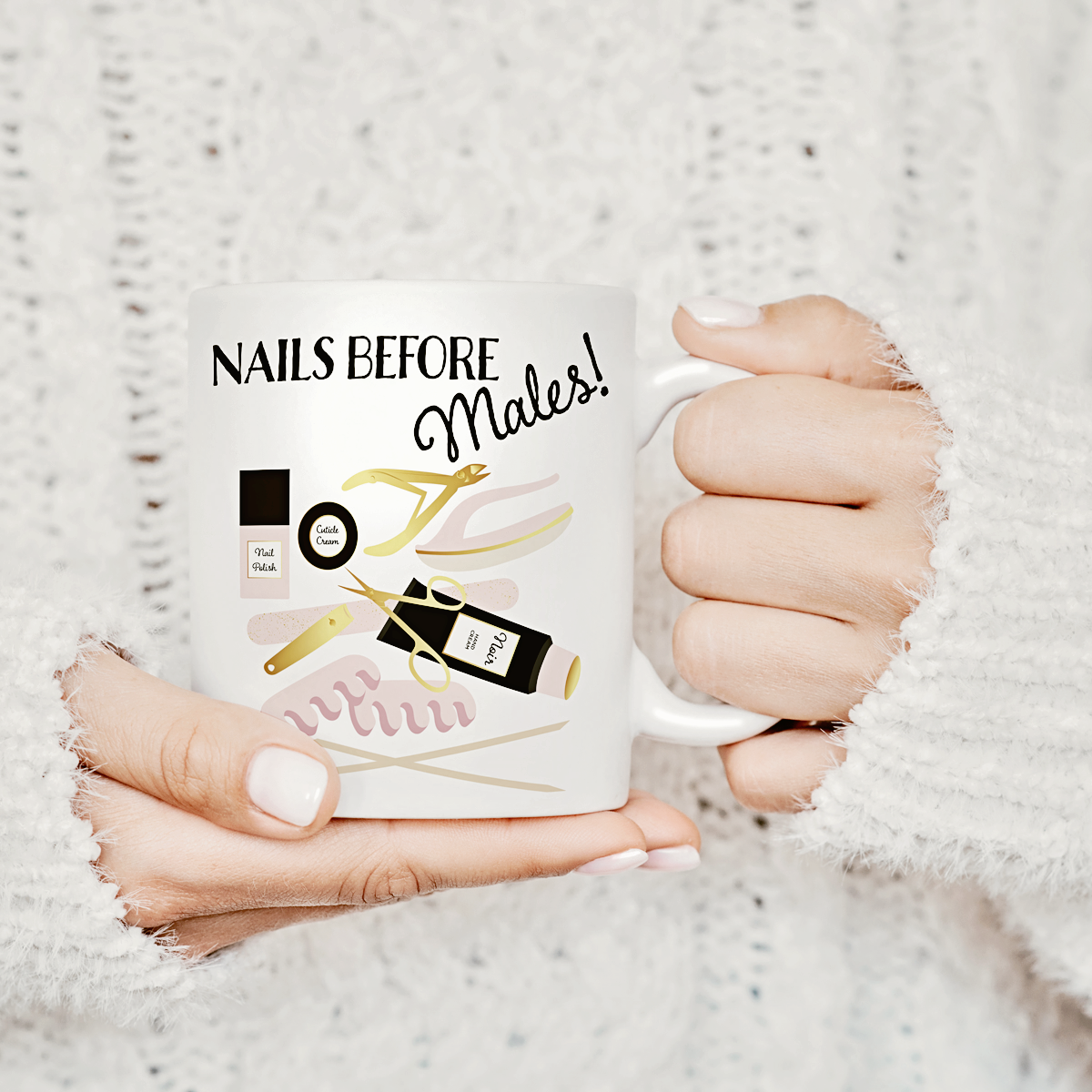 A close up image of a person holding a white mug featuring illustrations from the manicure collection of artwork and the words "Nails Before Males".